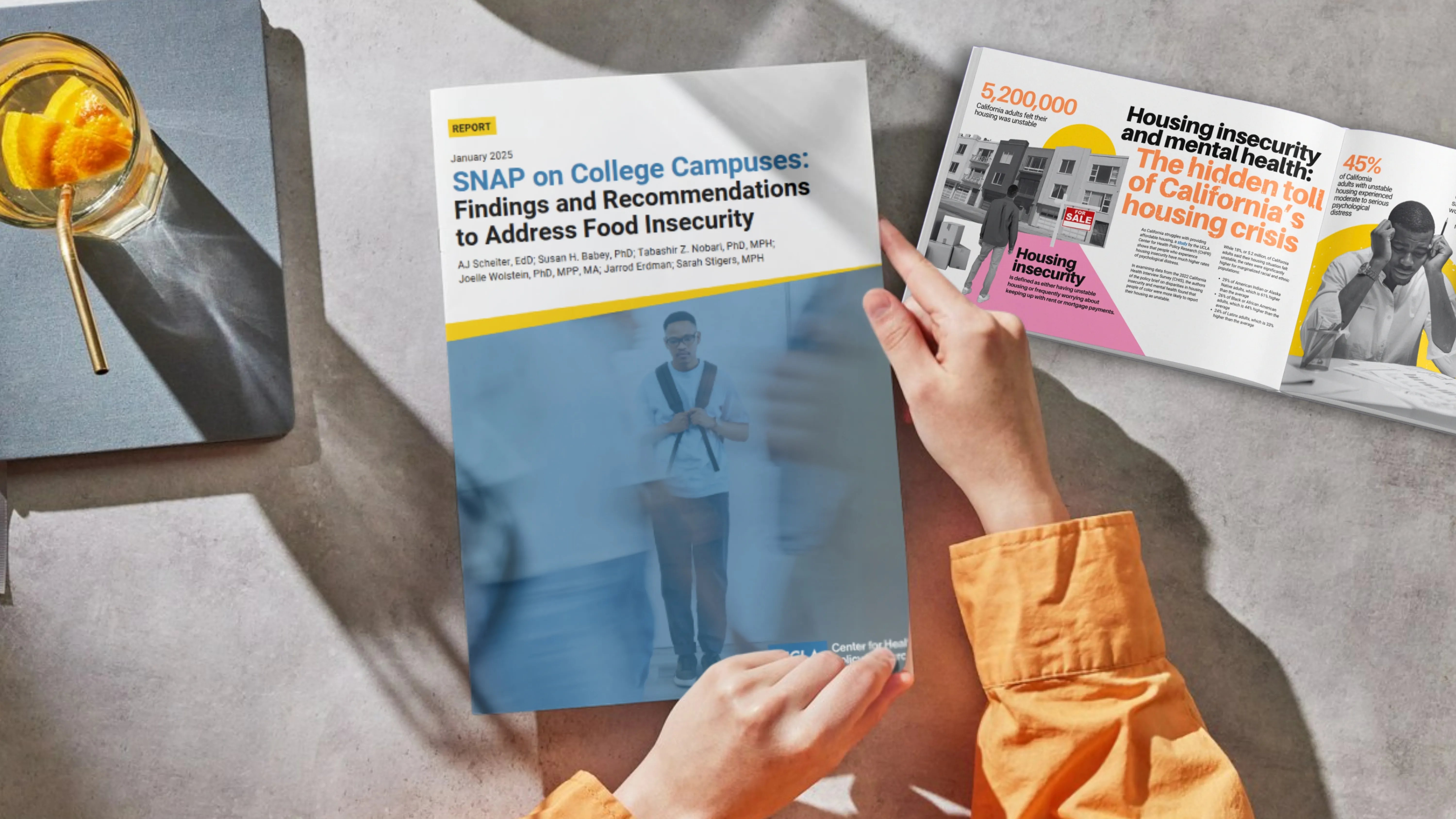 person holding UCLA CHPR publications