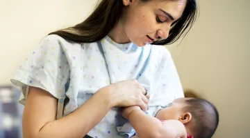 Woman breastfeeding her newborn, shutterstock_575749180