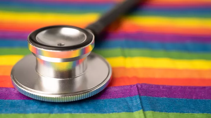 Photo of stethoscope on rainbow cloth