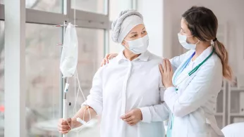 Doctor and woman undergoing chemical therapy course in clinic
